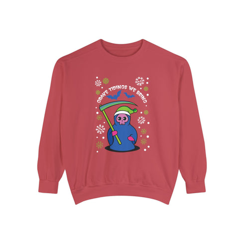 A holiday sweatshirt featuring a cute Grim Reaper holding a scythe, wearing a Santa hat. Above the character is the text "Grave Tidings We Bring," surrounded by festive snowflakes and holiday-themed designs. The combination of spooky and festive elements adds a humorous twist to traditional holiday attire.